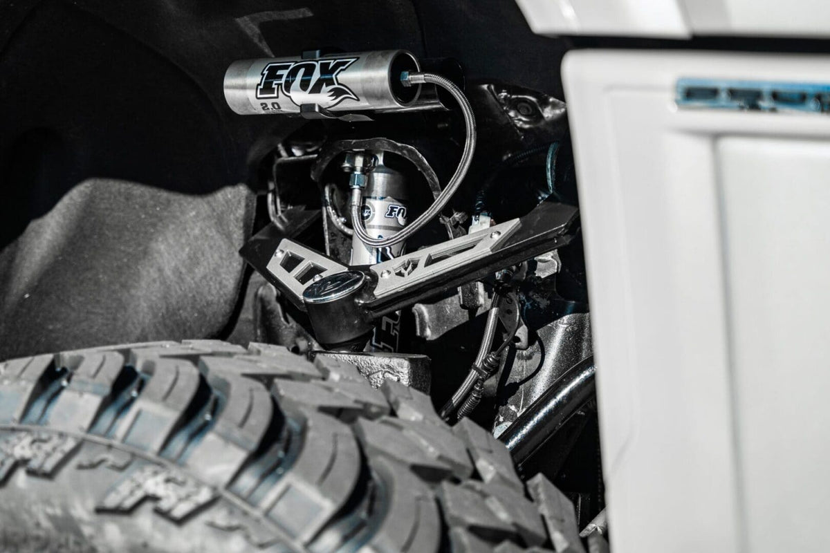 McGaughy's Front Upper Shock Reservoir Mounts 2011-2026 Silverado/Sierra 2500/3500 - 52357
