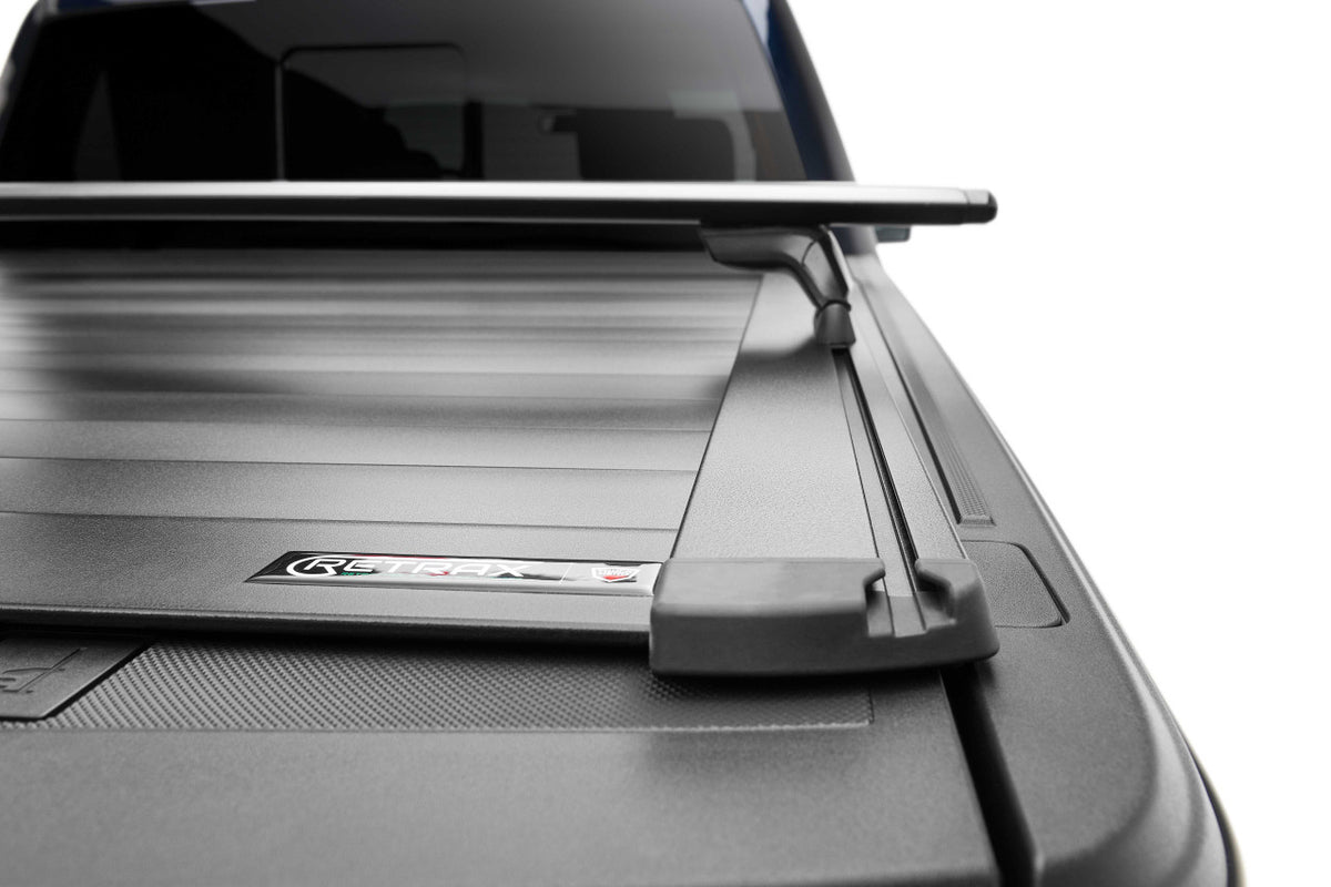Retrax RETRAXONE XR | Manual Polycarbonate Retractable Bed Cover | RAM 1500 DT 5'7" Crew Cab w/out RAMBOX